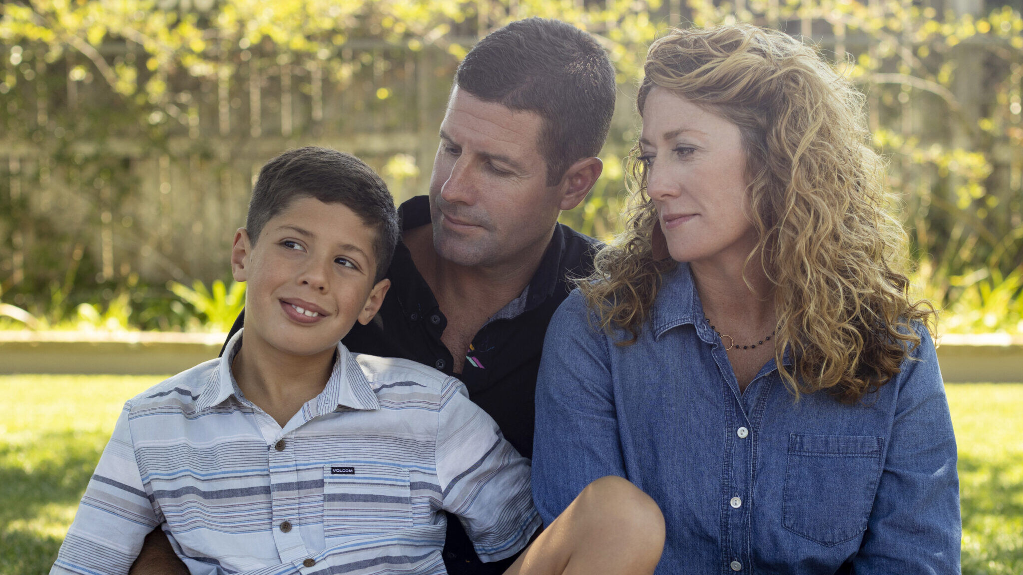 Logan Sadecki poses with his parents, Ian and Shannon, at their home in Buellton, Calif. 