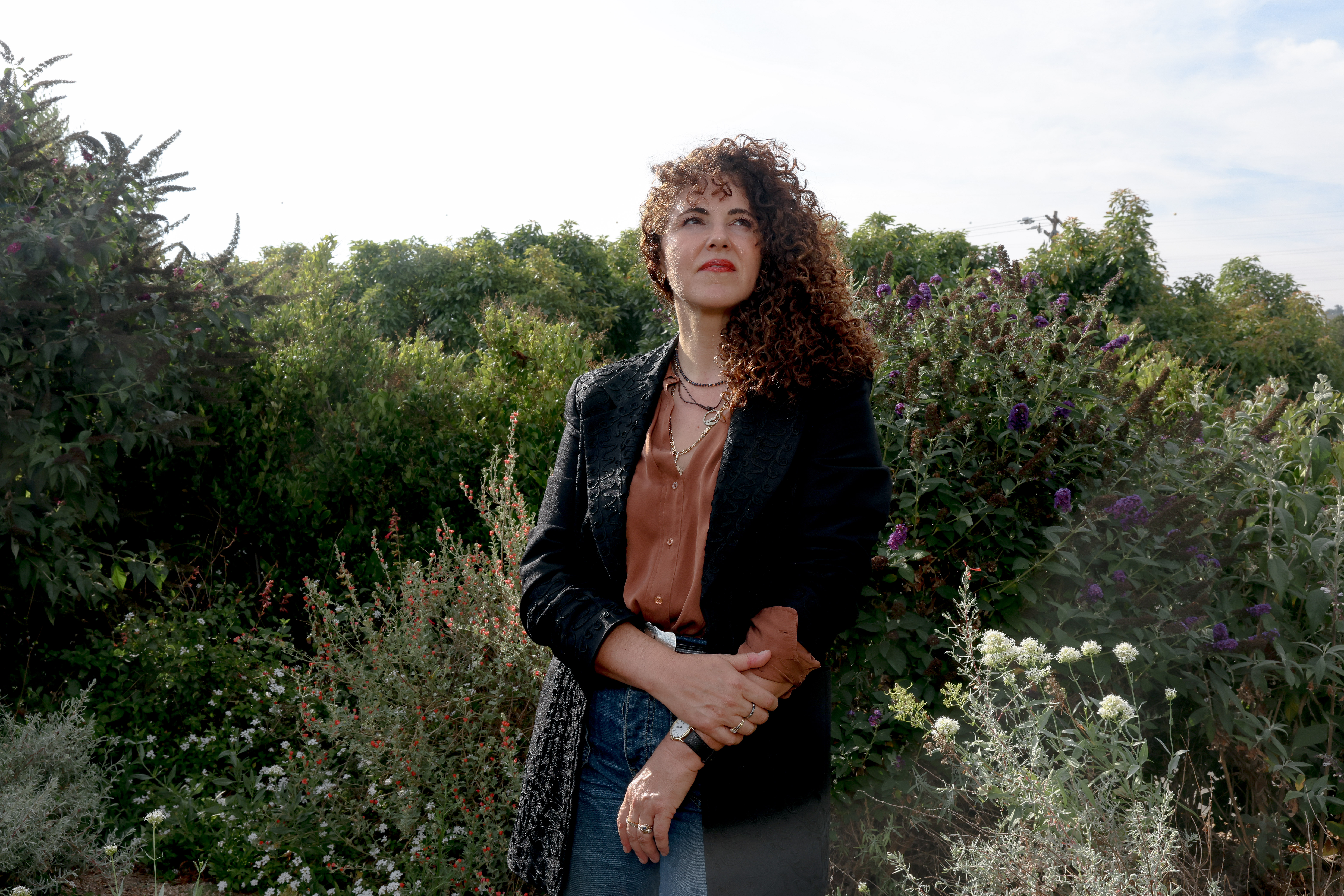 Writer Laurel Braitman poses for a portrait in a garden her mother planted for her before her death at her home in Santa Paula, California.
