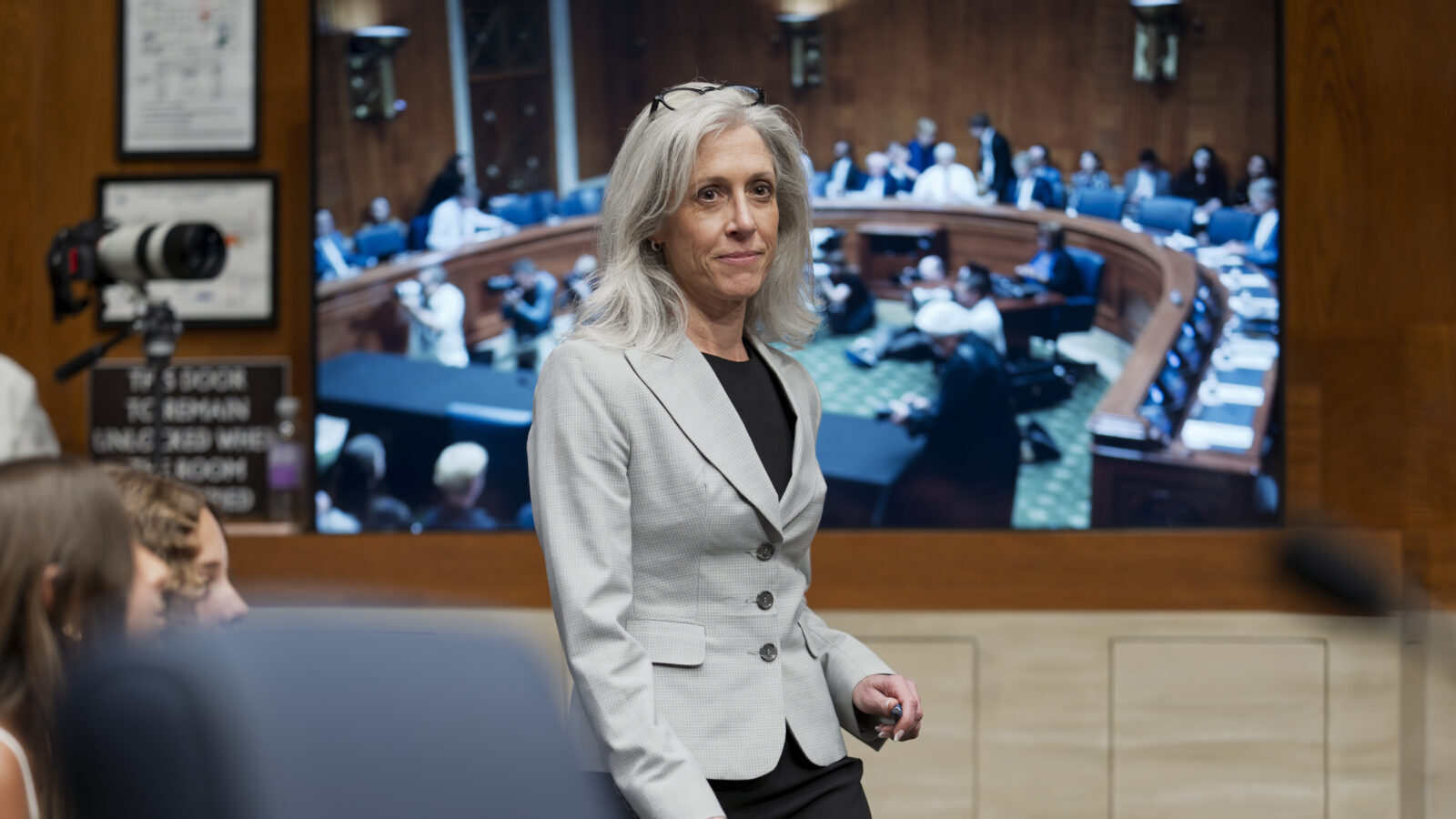 Susan Monarez stands with a half, closed mouth smile