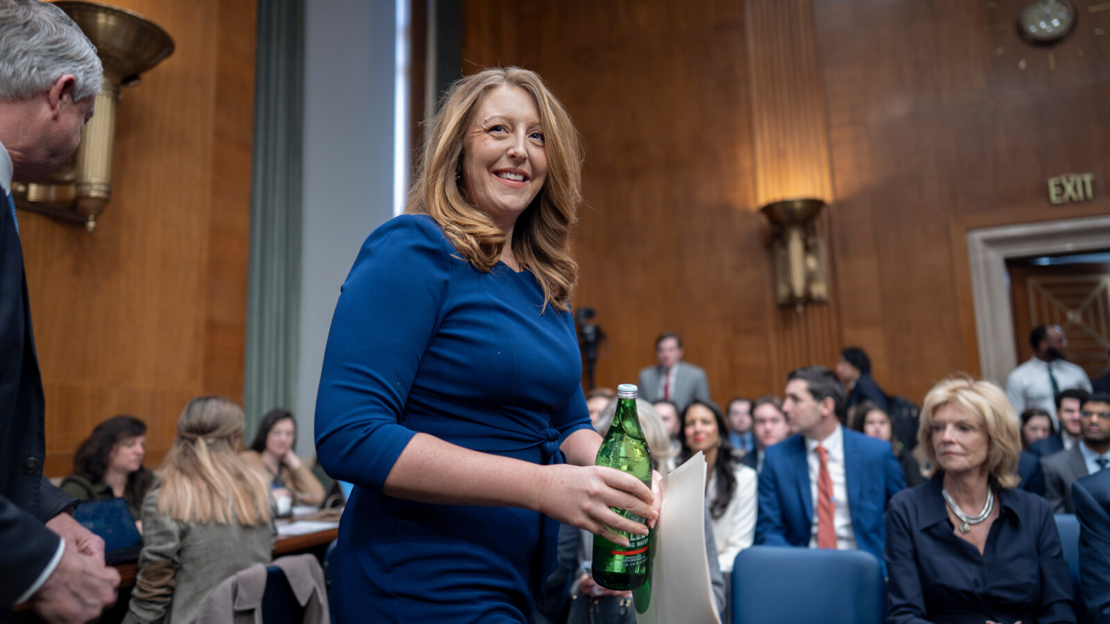 Casey Means smiles as she walks to her seat at the confirmation hearing yesterday.
