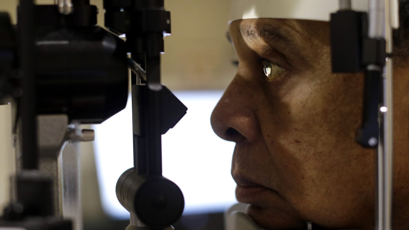 A person looks into an ocular machine