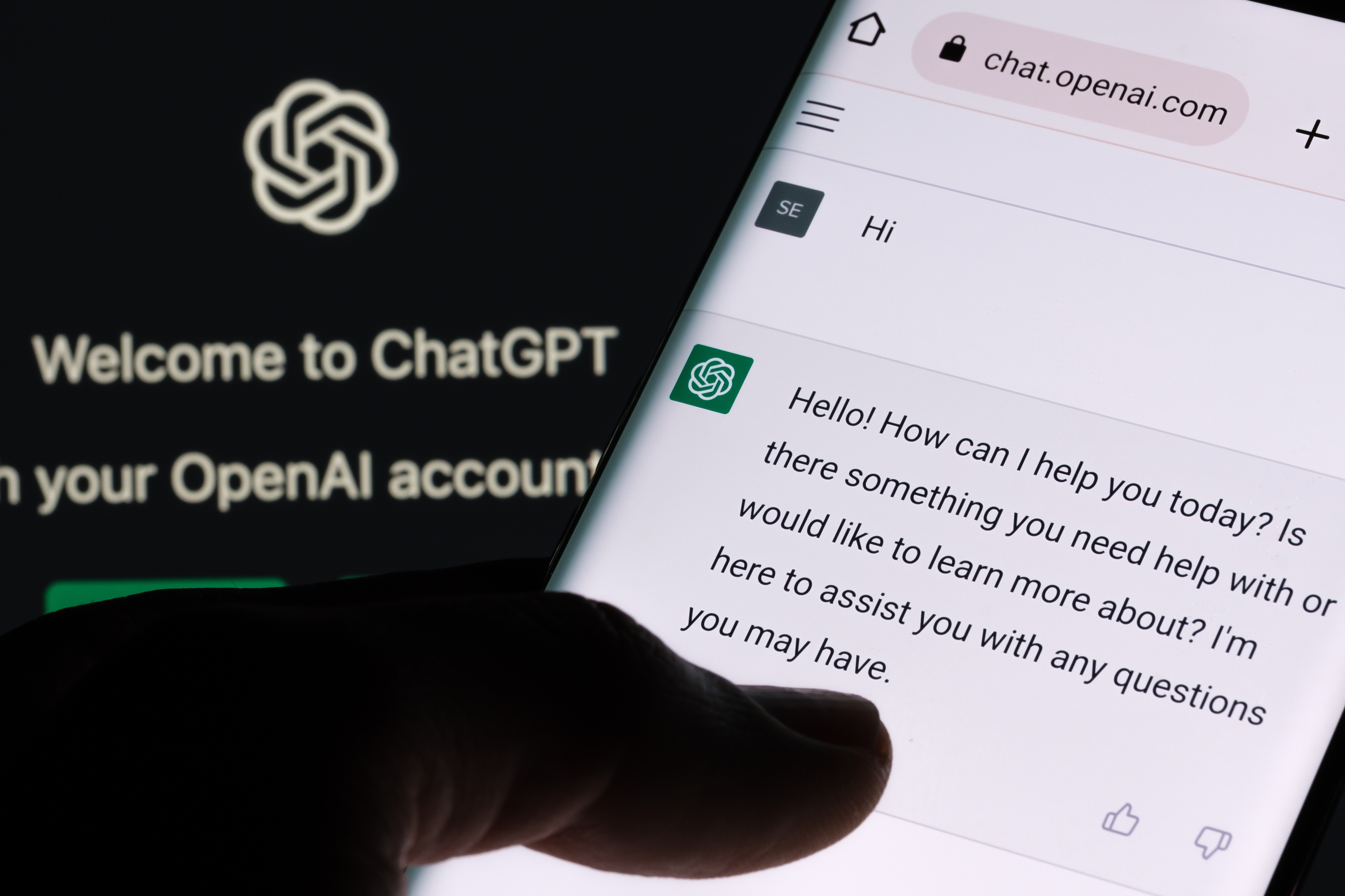 ChatGPT chat bot screen seen on smartphone and laptop screens