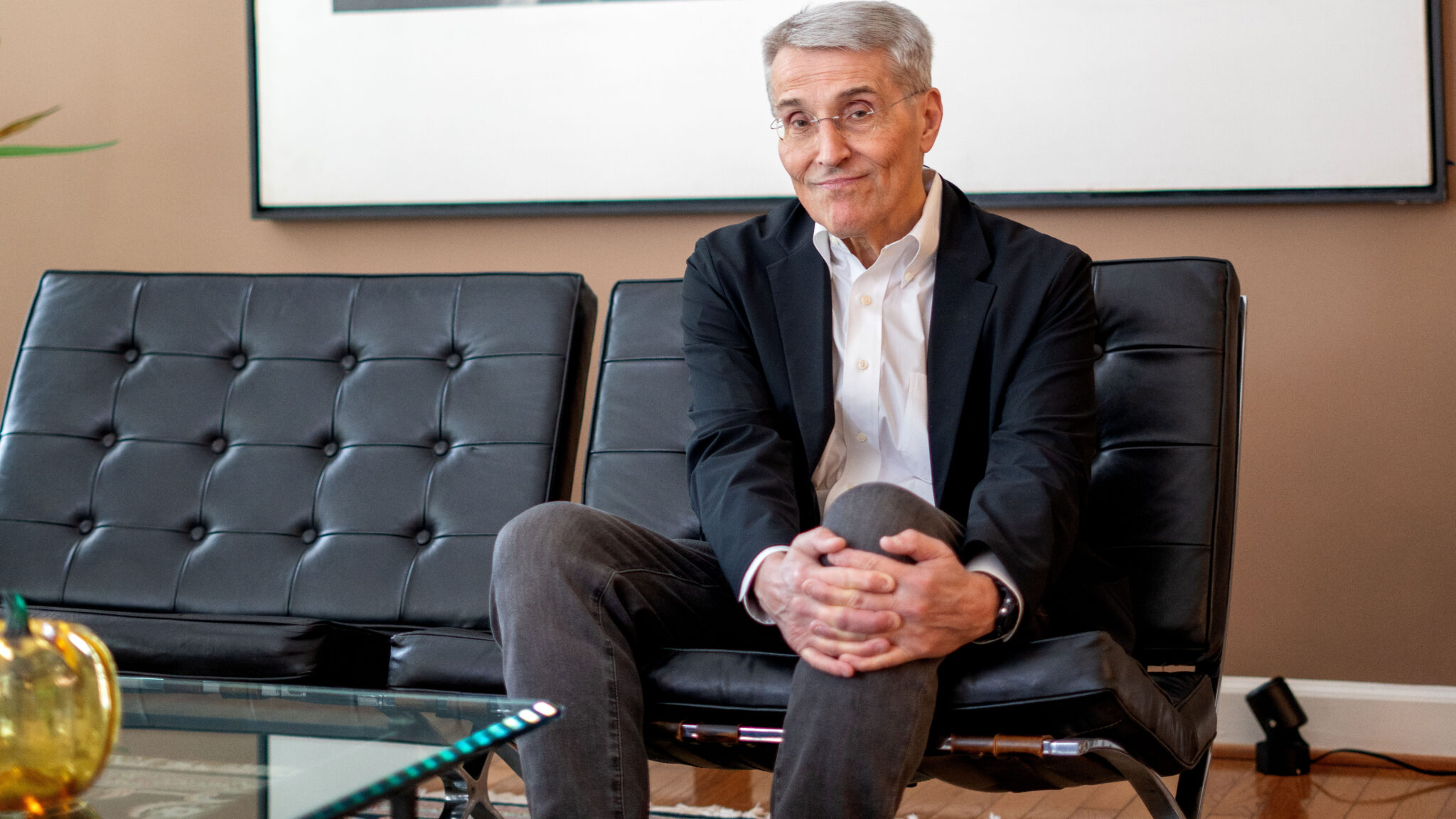 Richard Pazdur sits on a couch at his home, lips pursed