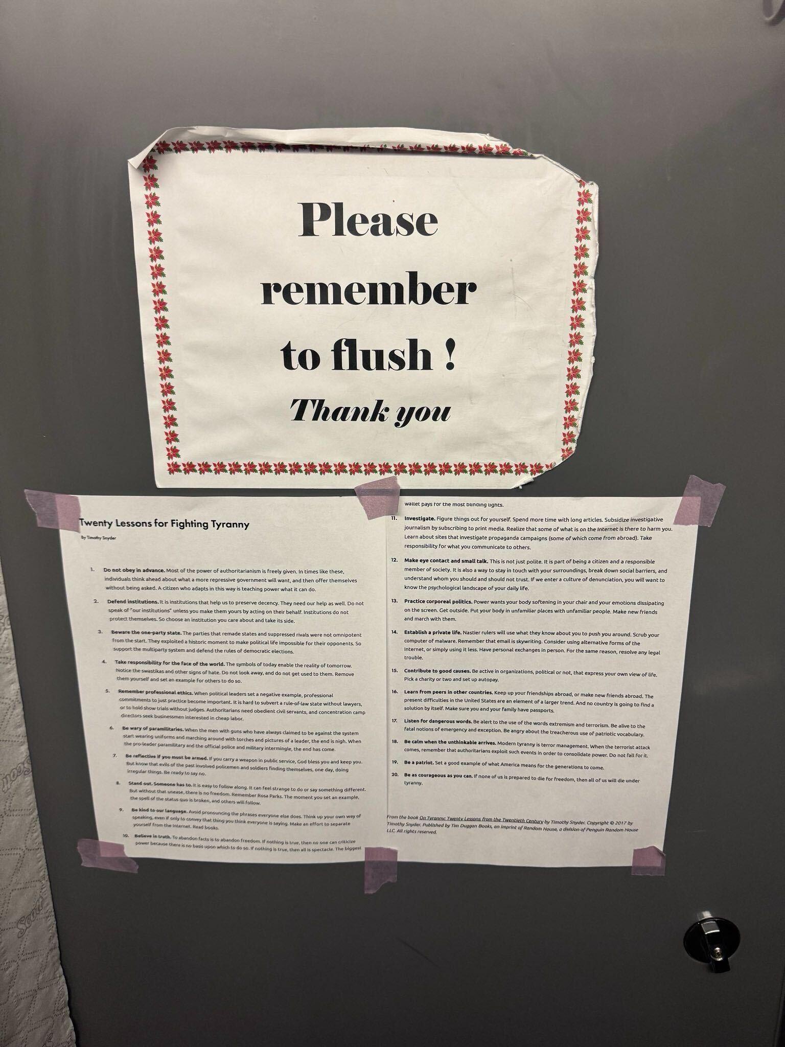 A bathroom sign that reads "Please remember to flush!" and underneath it, two pages of text titled "Twenty lessons for fighting tyranny."