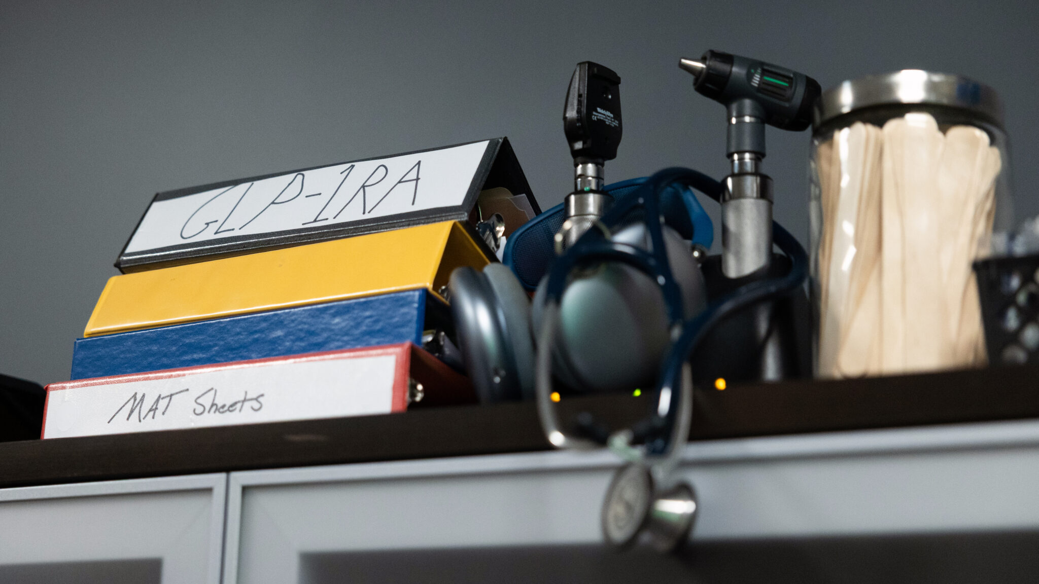 A binder with GLP-1 information in Steven Klein's office at Caron Treatment Centers in Wernersville, Pa.