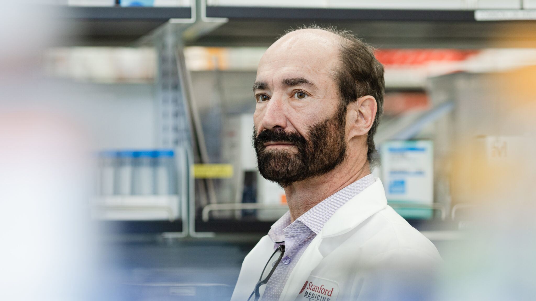 Michael Snyder, professor and chair of genetics at Stanford University, stands for a portrait at the Snyder Lab.