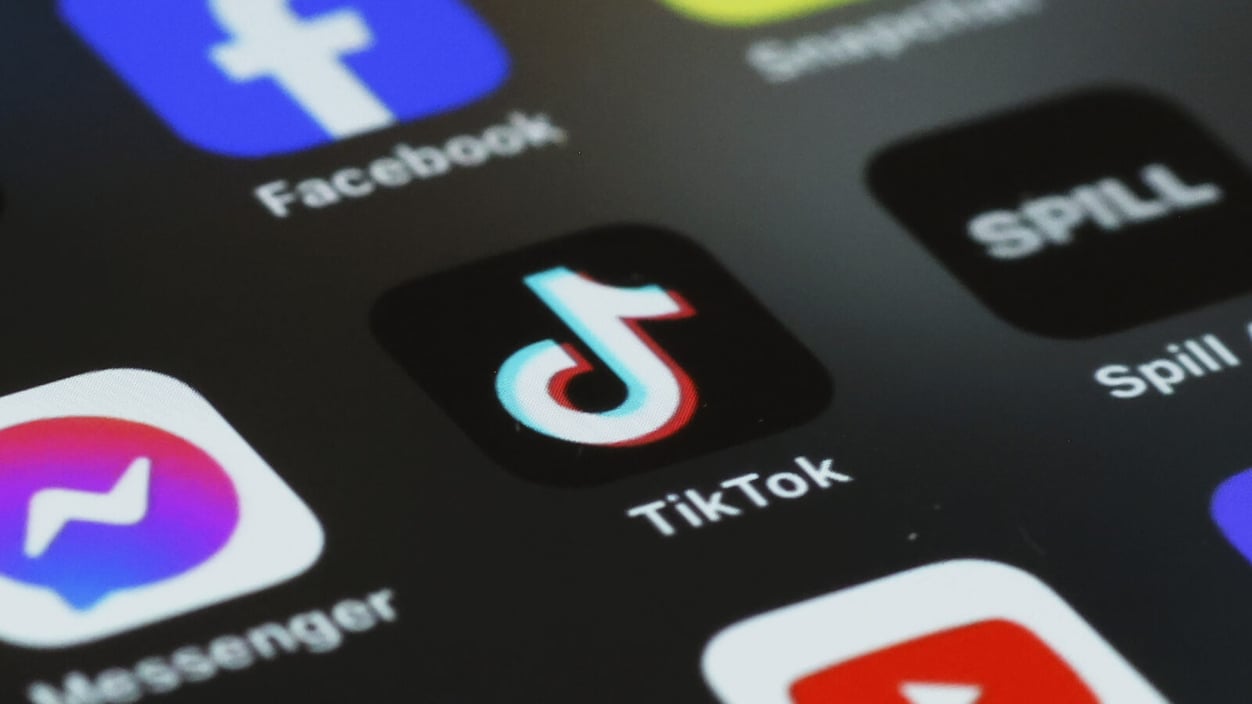 The TikTok icon is displayed on the homepage of a smart phone
