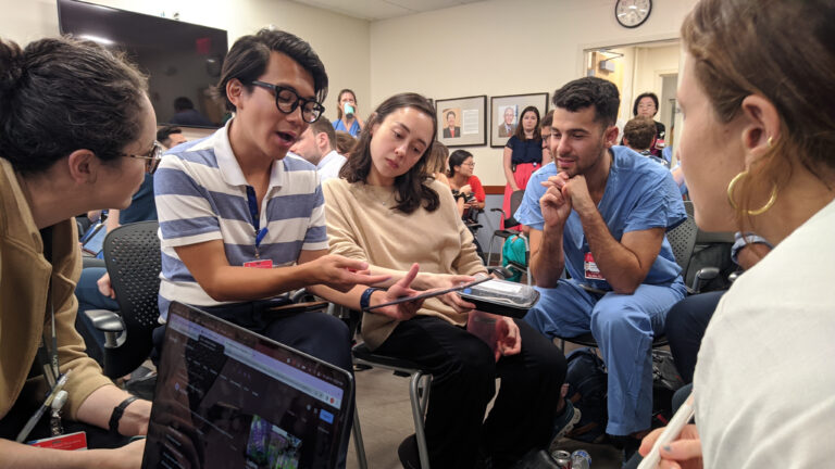 Second-year internal medicine resident Son Quyen Dinh points at ChatGPT's output during a resident workshop at Beth Israel Deaconess Medical Center.