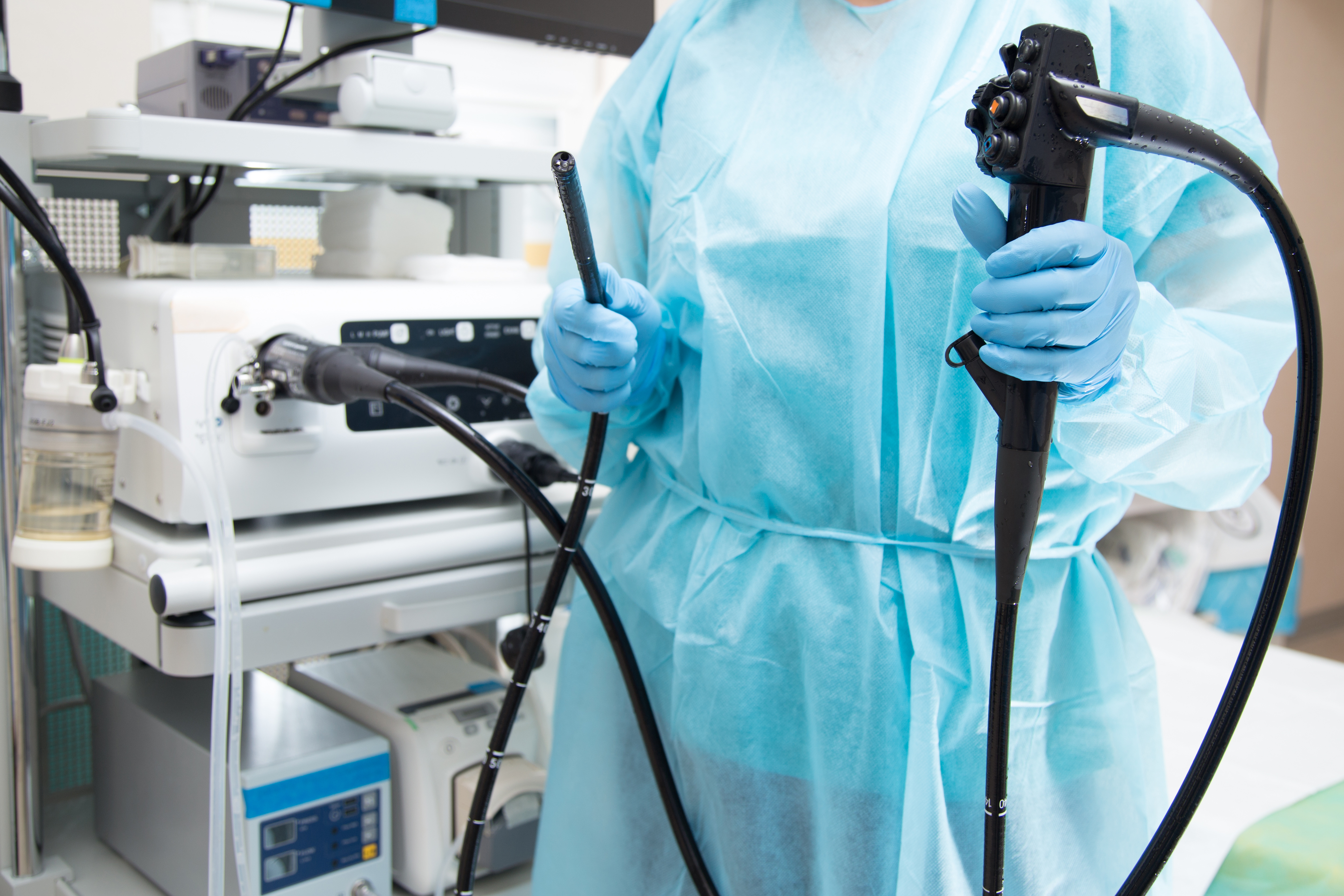 A doctor holds an endoscope