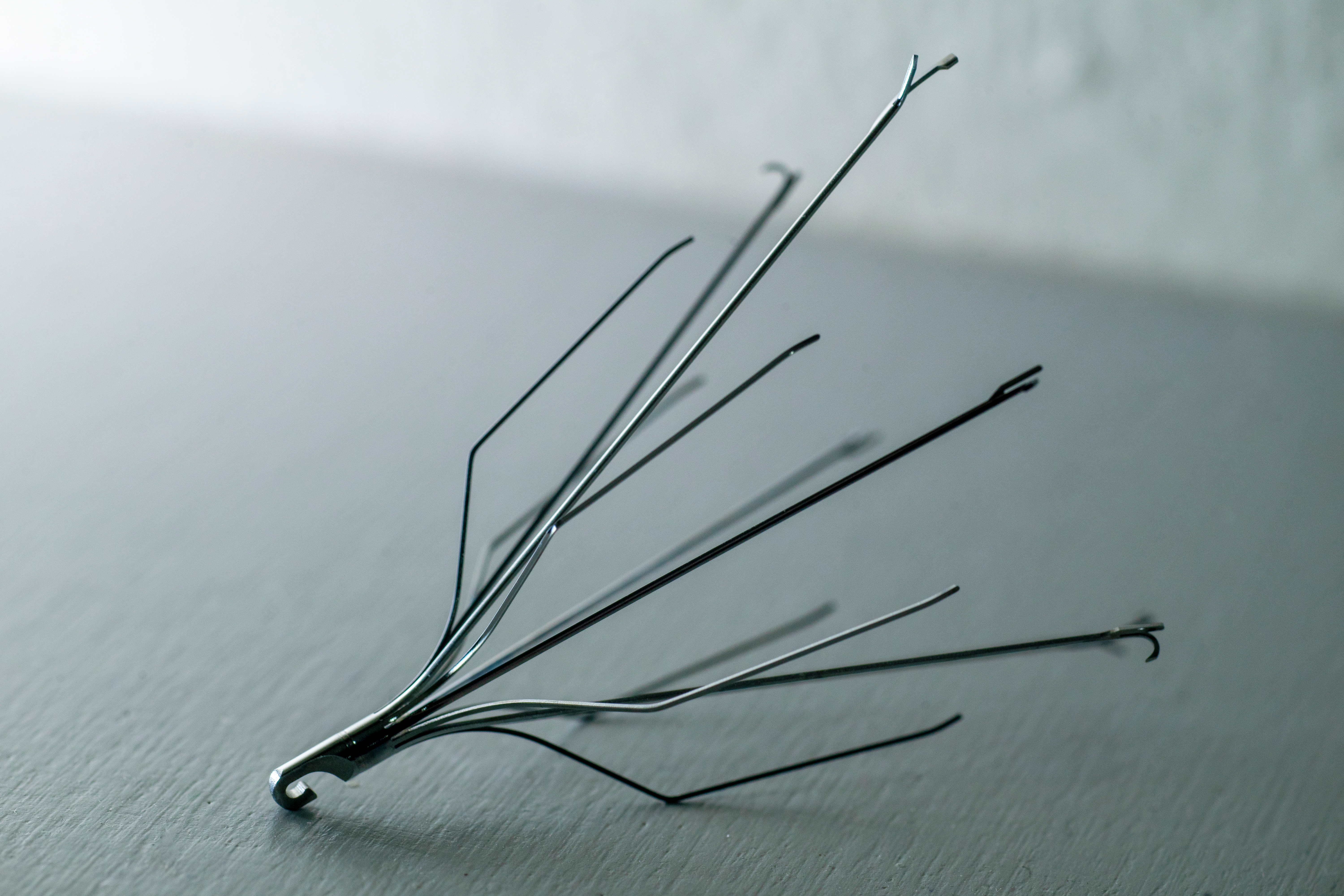 An IVC filter lays on the ground