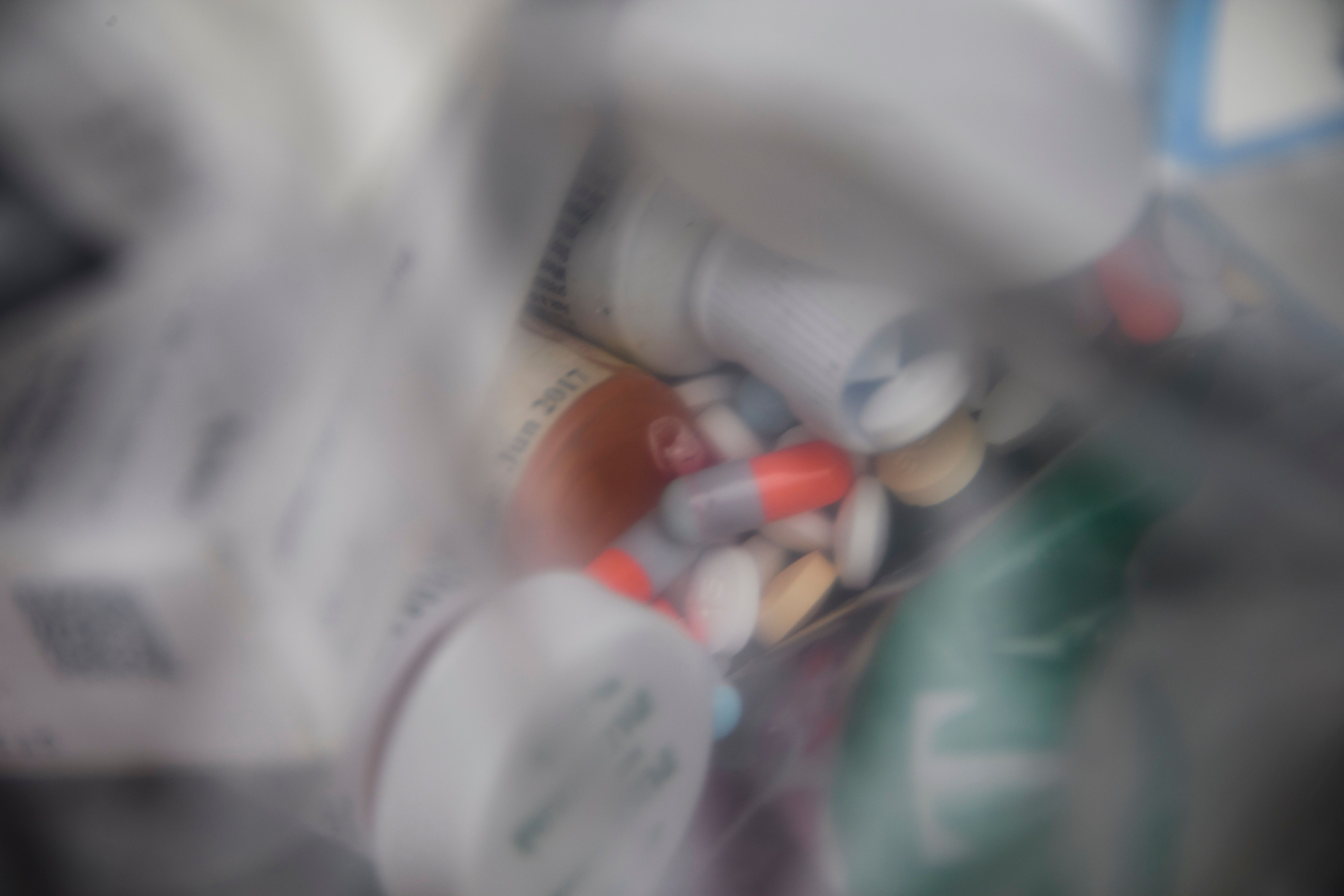 A plastic bag of assorted pills and prescription drugs.