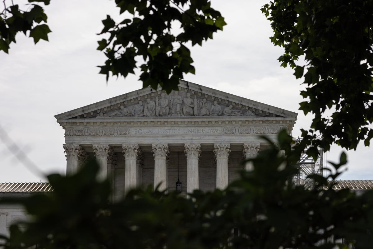 The Supreme Court surrounded by trees.