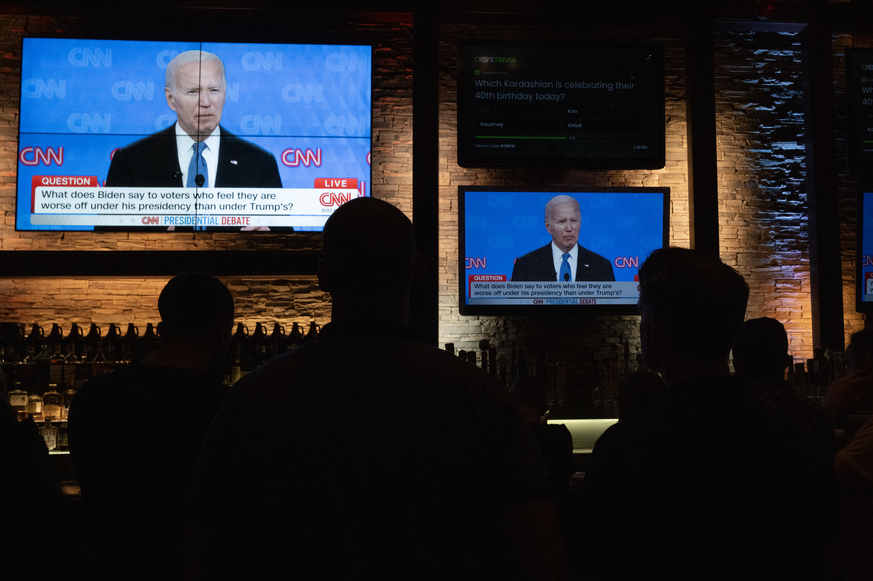 A photograph of Guests at the Old Town Pour House watch the debate between President Joe Biden and presumptive Republican nominee former President Donald Trump on June 27, 2024 in Chicago, Illinois