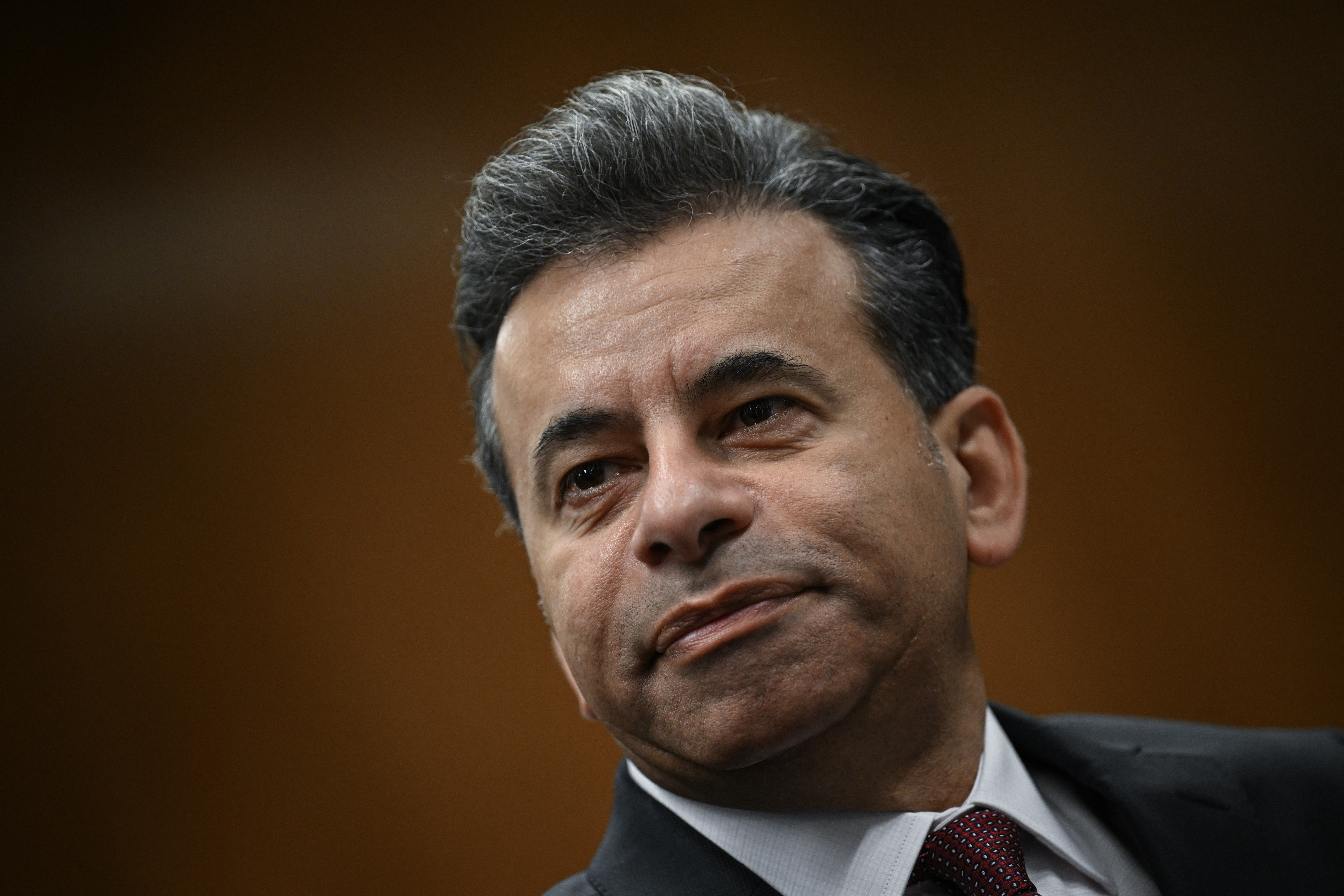 A close-up of Marty Makary's face, serious, at an almost Dutch angle (slanted slightly)