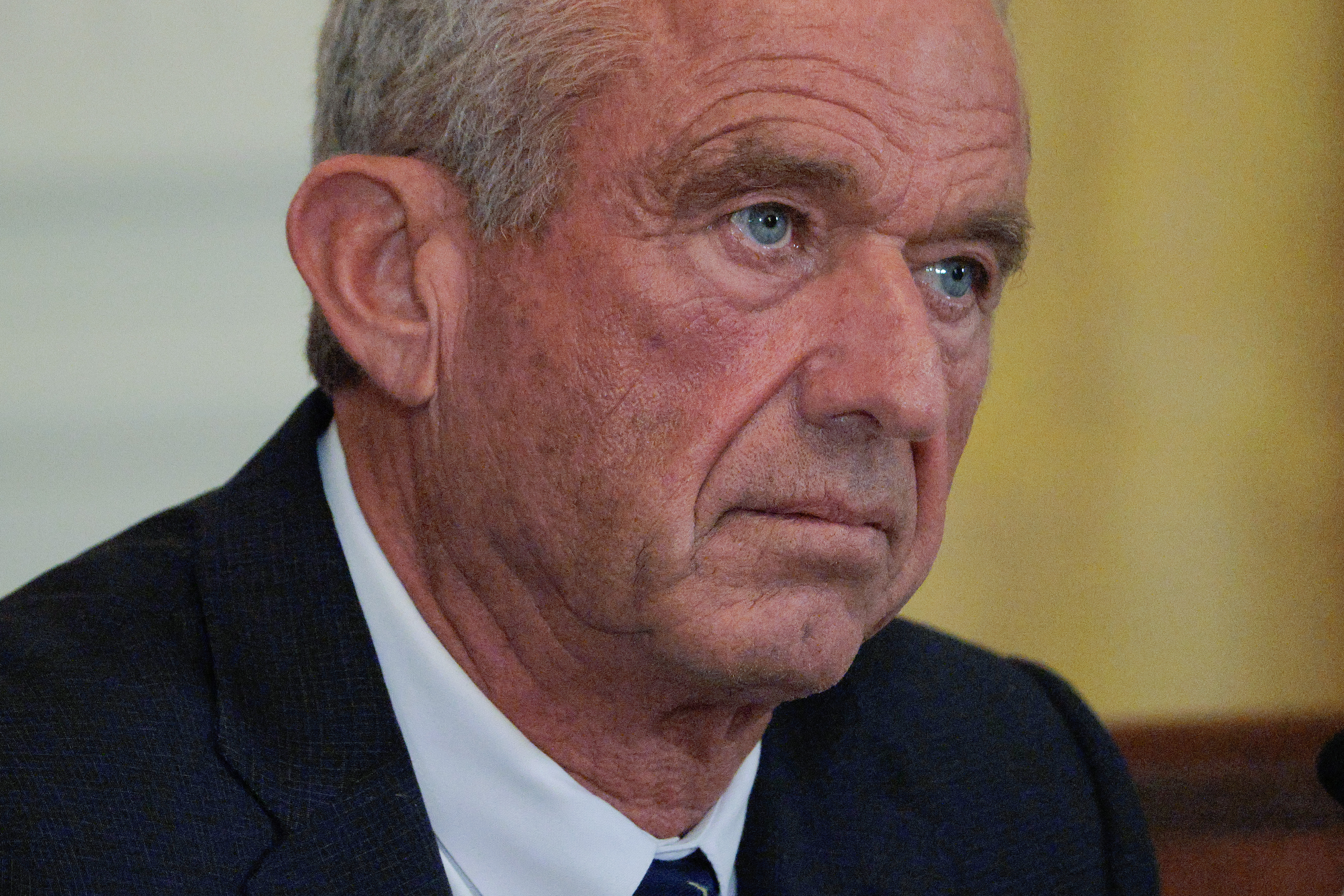 A close up of Kennedy's face, looking serious.