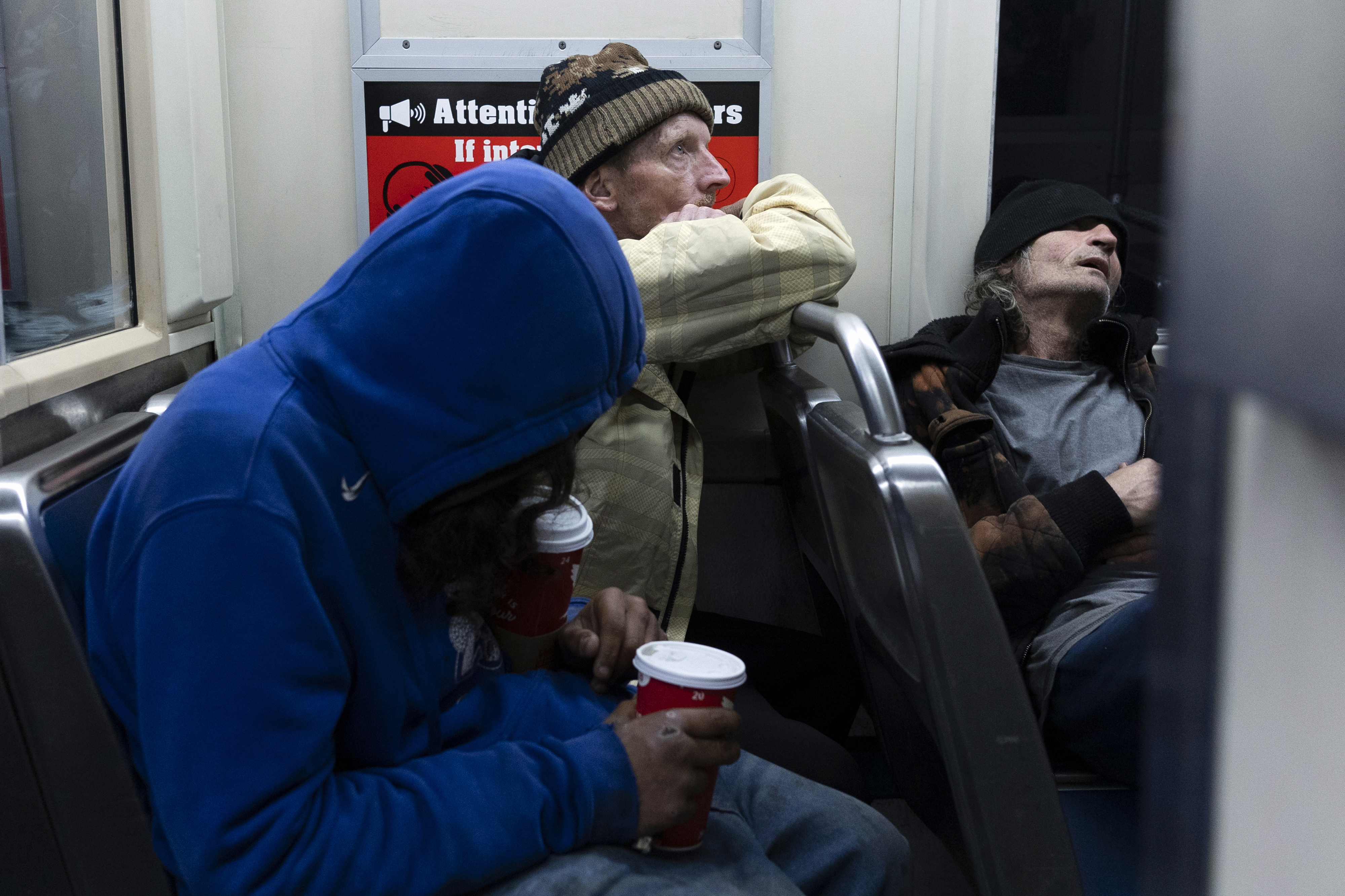 Shaun Anderson rides the subway with friends in May, one day after moving into an apartment found with the help of a social services organization, Prevention Point. 
