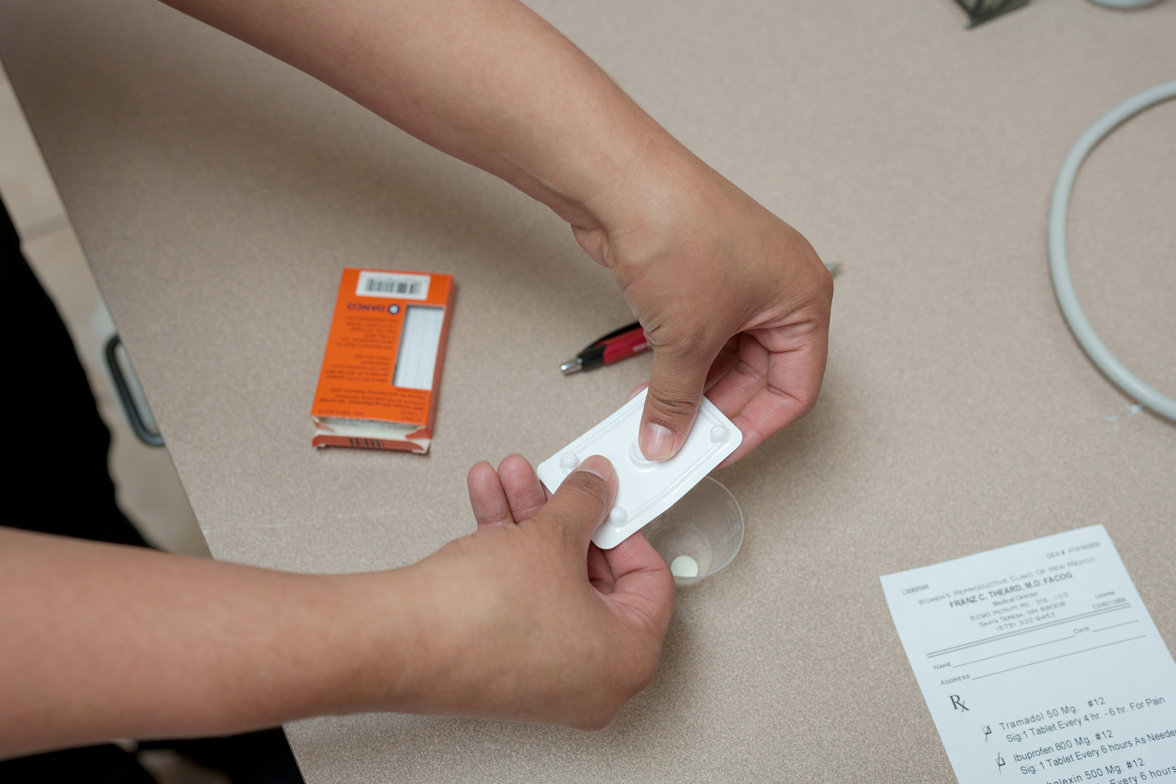 A staffer at the Women's Reproductive Clinic in Santa Teresa, N.M., prepares a dose of mifepristone.